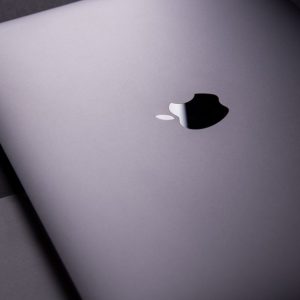 Close-up of a sleek, modern laptop featuring a minimalist design on a dark surface.