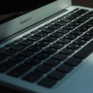 Close-up view of a MacBook Air keyboard with Cyrillic characters, photographed indoors in Jönköping, Sweden.